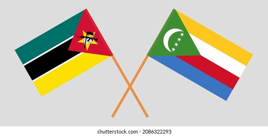 Crossed flags of Mozambique and the Comoros. Official colors. Correct proportion. Vector illustration
