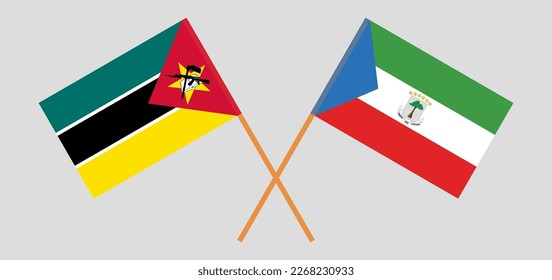 Banderas cruzadas de Mozambique y Guinea Ecuatorial. Colores oficiales. Proporción correcta