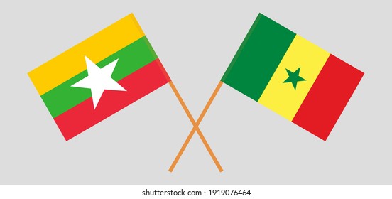 Crossed flags of Myanmar and Senegal