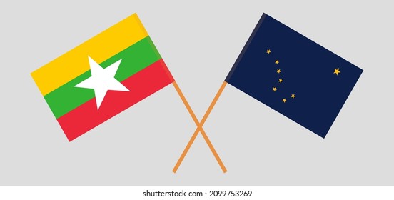 Crossed flags of Myanmar and the State of Alaska. Official colors. Correct proportion. Vector illustration
