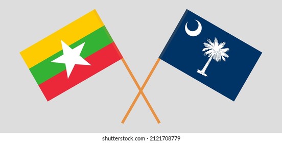 Crossed flags of Myanmar and The State of South Carolina. Official colors. Correct proportion. Vector illustration
