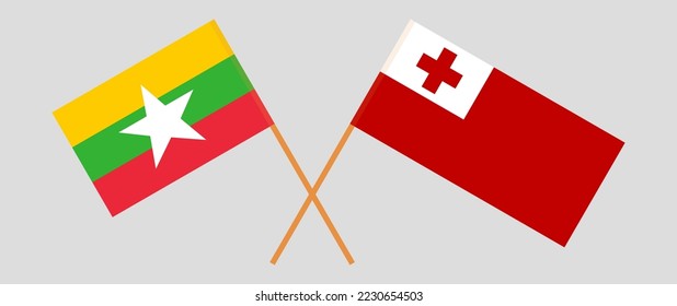 Crossed flags of Myanmar and Tonga. Official colors. Correct proportion. Vector illustration
