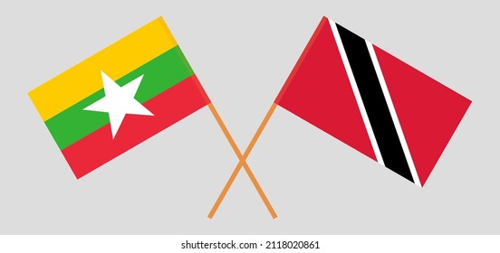 Crossed flags of Myanmar and Trinidad and Tobago. Official colors. Correct proportion. Vector illustration
