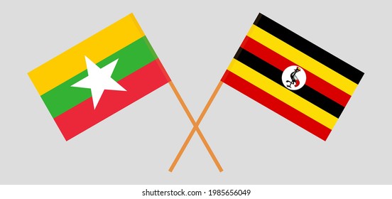 Crossed flags of Myanmar and Uganda. Official colors. Correct proportion