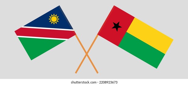 Crossed flags of Namibia and Guinea-Bissau. Official colors. Correct proportion. Vector illustration
