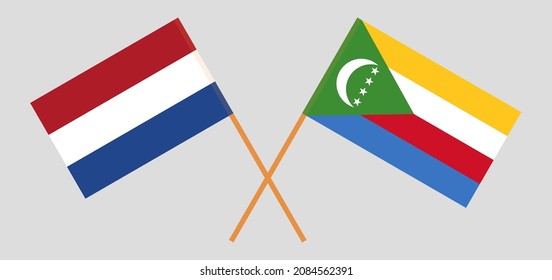 Crossed flags of the Netherlands and the Comoros. Official colors. Correct proportion. Vector illustration
