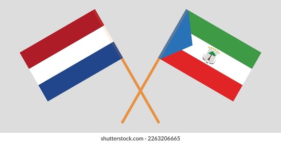 Crossed flags of the Netherlands and Equatorial Guinea. Official colors. Correct proportion. Vector illustration
