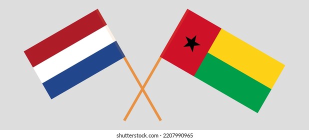 Crossed flags of the Netherlands and Guinea-Bissau. Official colors. Correct proportion. Vector illustration

