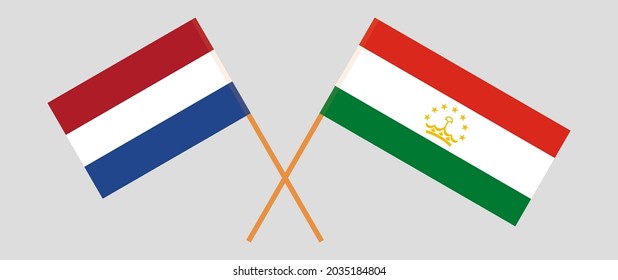 Crossed flags of the Netherlands and Tajikistan. Official colors. Correct proportion