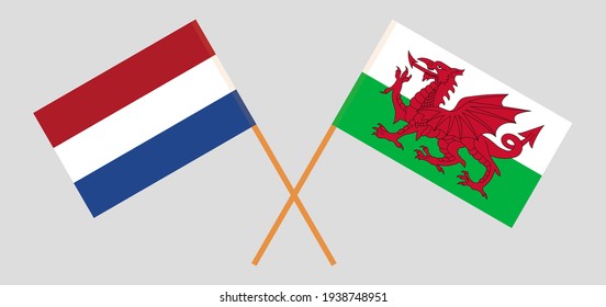 Crossed flags of the Netherlands and Wales. Official colors. Correct proportion