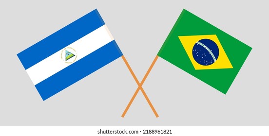 Crossed flags of Nicaragua and Brazil. Official colors. Correct proportion. Vector illustration
