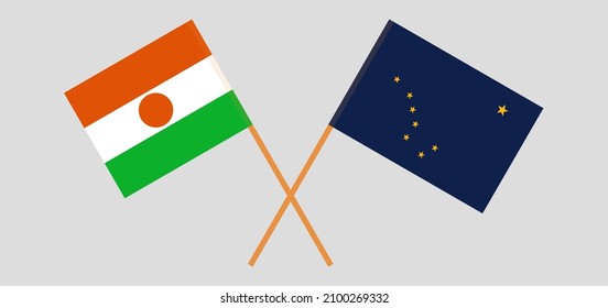 Crossed flags of Niger and the State of Alaska. Official colors. Correct proportion. Vector illustration
