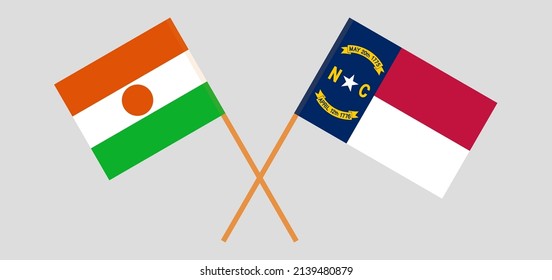 Banderas cruzadas de Níger y El estado de Carolina del Norte. Colores oficiales. Proporción correcta. Ilustración del vector
