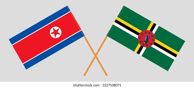 Crossed flags of North Korea and Dominica. Official colors. Correct proportion. Vector illustration
