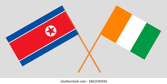 Crossed flags of North Korea and Republic of Ivory Coast