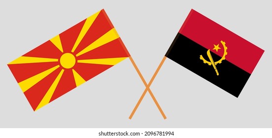 Crossed flags of North Macedonia and Angola. Official colors. Correct proportion. Vector illustration

