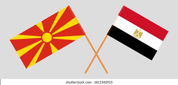 Crossed flags of North Macedonia and Egypt. Official colors. Correct proportion. Vector illustration
