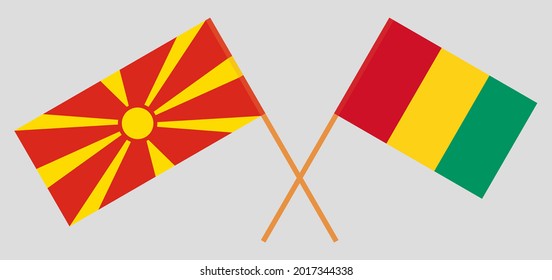 Banderas cruzadas del norte de Macedonia y Guinea. Colores oficiales. Proporción correcta