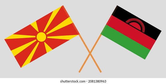 Crossed flags of North Macedonia and Malawi. Official colors. Correct proportion. Vector illustration
