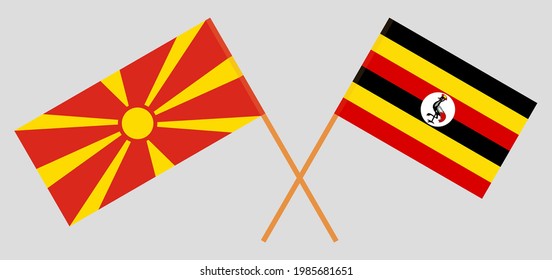 Crossed flags of North Macedonia and Uganda. Official colors. Correct proportion