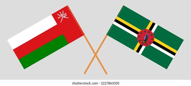 Crossed flags of Oman and Dominica. Official colors. Correct proportion. Vector illustration
