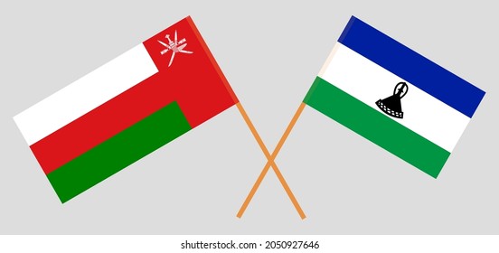 Crossed flags of Oman and the Kingdom of Lesotho. Official colors. Correct proportion