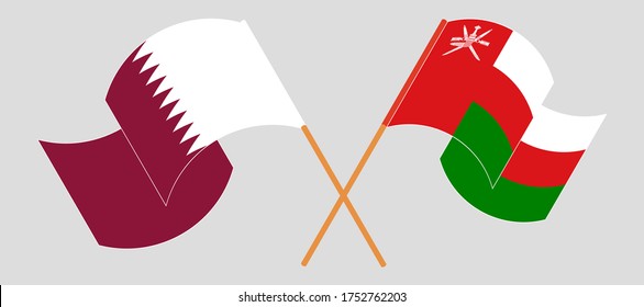 Banderas cruzadas de Omán y Qatar