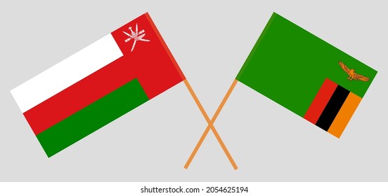 Crossed flags of Oman and the Republic of Zambia. Official colors. Correct proportion