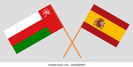 Crossed flags of Oman and Spain. Official colors. Correct proportion. Vector illustration
