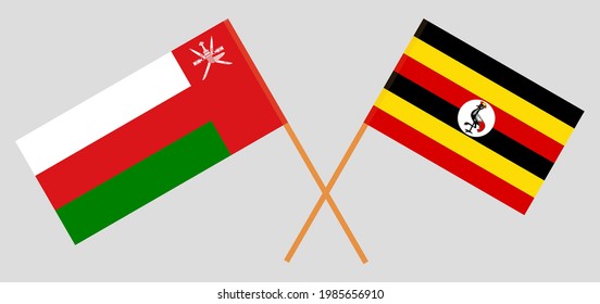Crossed flags of Oman and Uganda. Official colors. Correct proportion