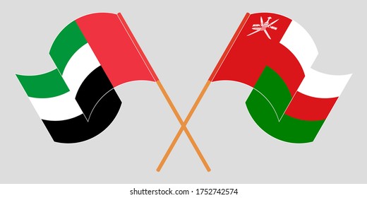 Crossed flags of Oman and the United Arab Emirates