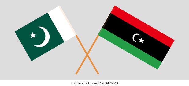 Banderas cruzadas de Pakistán y Libia. Colores oficiales. Proporción correcta