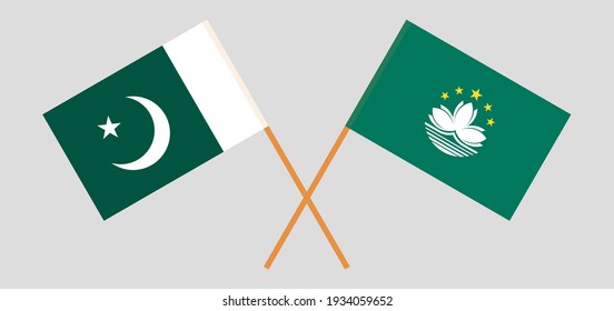 Crossed flags of Pakistan and Macau. Official colors. Correct proportion