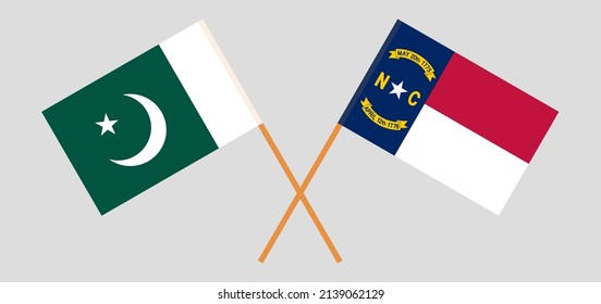 Crossed flags of Pakistan and The State of North Carolina. Official colors. Correct proportion. Vector illustration
