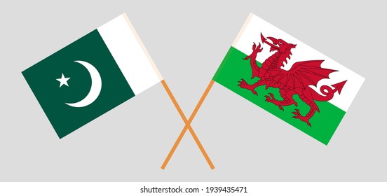 Crossed flags of Pakistan and Wales. Official colors. Correct proportion
