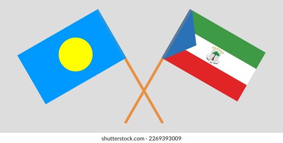 Crossed flags of Palau and Equatorial Guinea. Official colors. Correct proportion. Vector illustration

