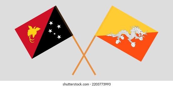 Crossed flags of Papua New Guinea and Bhutan. Official colors. Correct proportion. Vector illustration
