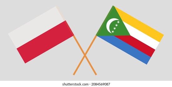 Crossed flags of Poland and the Comoros. Official colors. Correct proportion. Vector illustration
