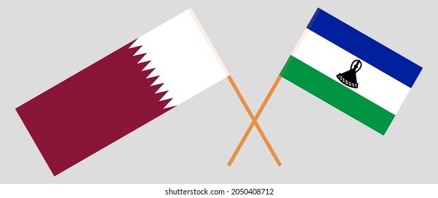 Crossed flags of Qatar and the Kingdom of Lesotho. Official colors. Correct proportion