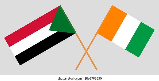 Crossed flags of Republic of Ivory Coast and Sudan