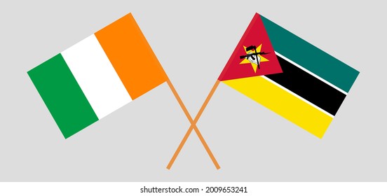 Crossed flags of Republic of Ivory Coast and Mozambique. Official colors. Correct proportion