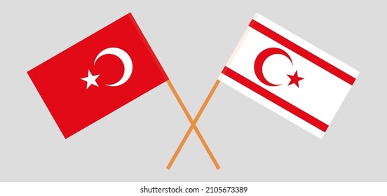 Crossed flags of the Republic of Türkiye and Northern Cyprus. Official colors. Correct proportion. Vector illustration
