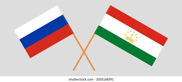 Crossed flags of Russia and Tajikistan. Official colors. Correct proportion