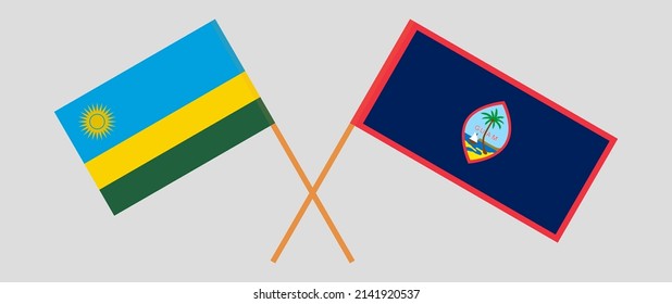 Crossed flags of Rwanda and Guam. Official colors. Correct proportion. Vector illustration
