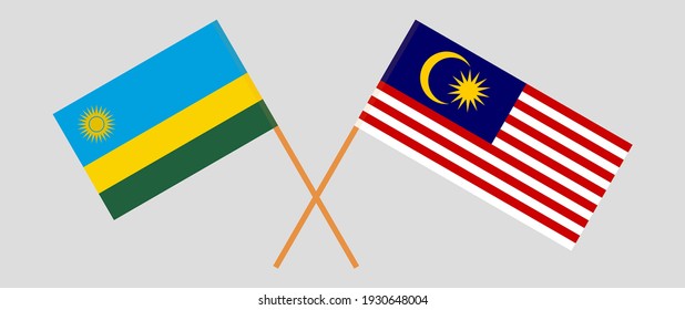 Crossed flags of Rwanda and Malaysia. Official colors. Correct proportion