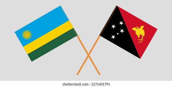 Crossed flags of Rwanda and Papua New Guinea. Official colors. Correct proportion. Vector illustration
