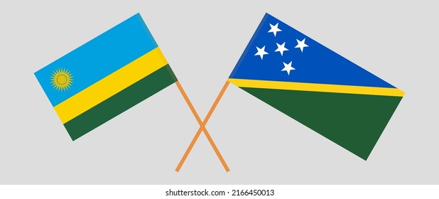 Crossed flags of Rwanda and Solomon Islands. Official colors. Correct proportion. Vector illustration
