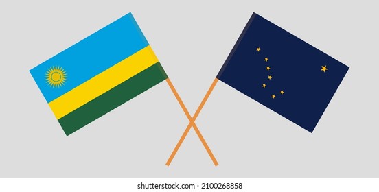Crossed flags of Rwanda and the State of Alaska. Official colors. Correct proportion. Vector illustration
