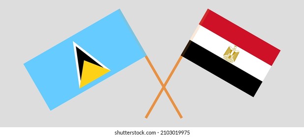 Überquerte Flaggen von Saint Lucia und Ägypten. Offizielle Farben. Richtiger Anteil. Vektorgrafik
