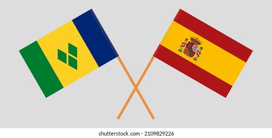 Crossed flags of Saint Vincent and the Grenadines and Spain. Official colors. Correct proportion. Vector illustration
